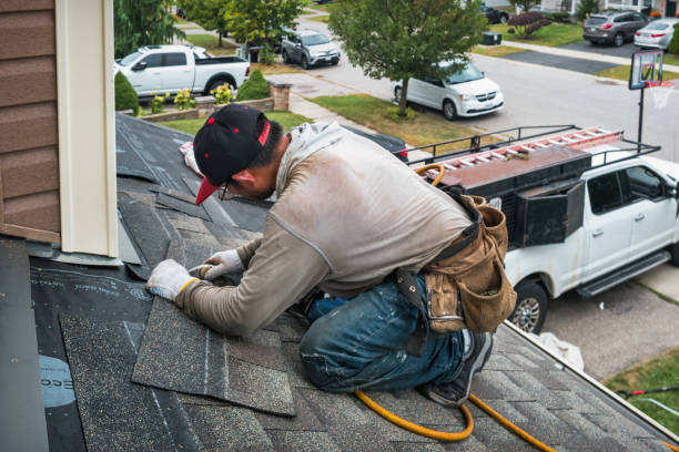 Professional Roofing technician working in Glen Head, NY